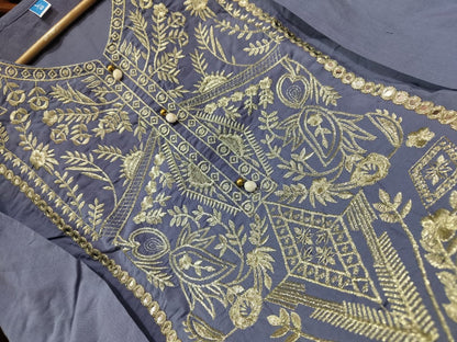 elegant grey ethnic kurta with detailed embroidery, styled with statement choker